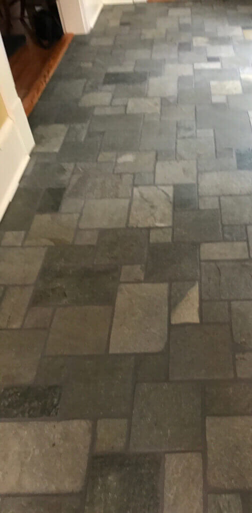 Floor tile restoration with renewed grout and cleaning