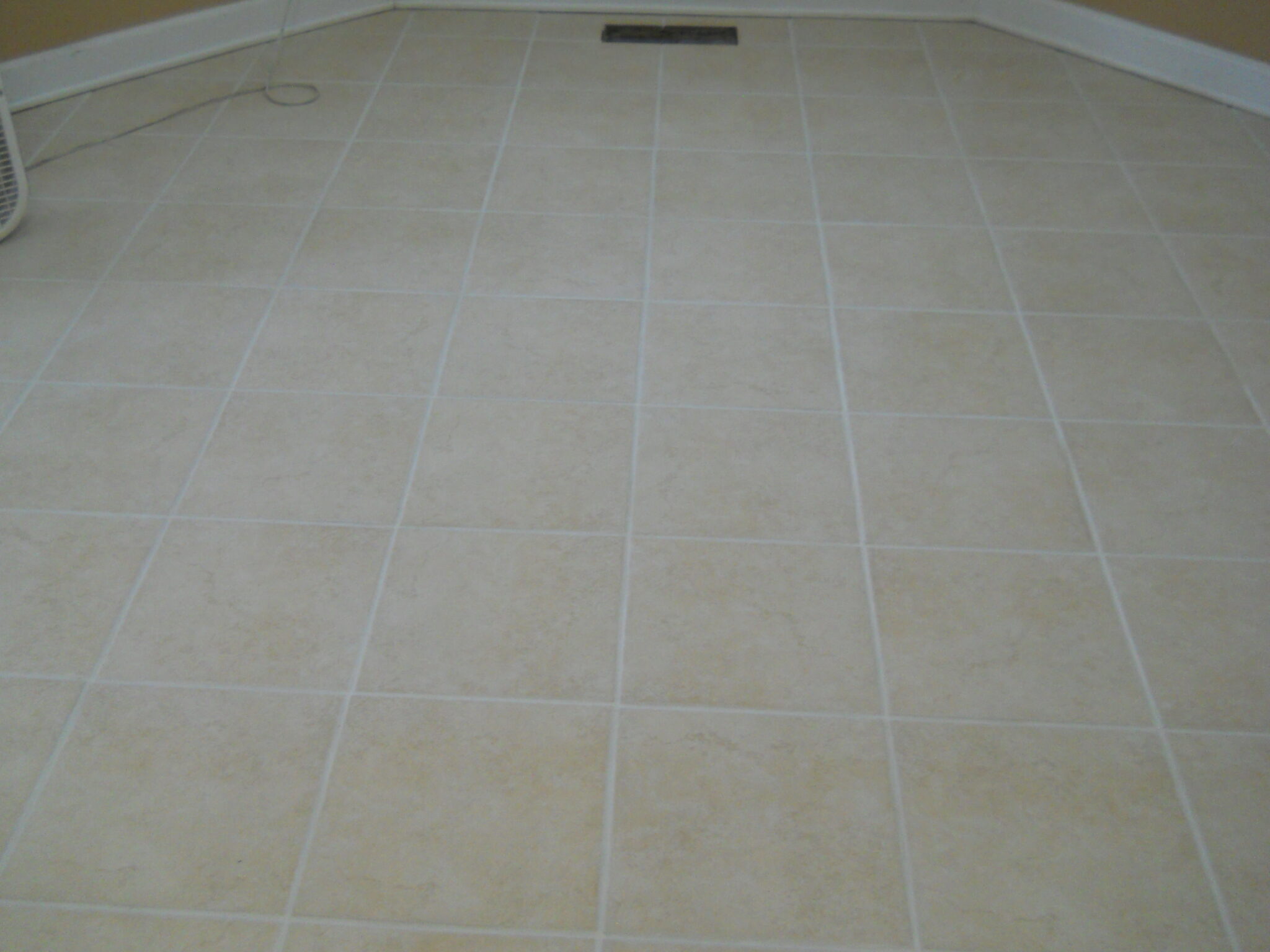 Tile floor after professional steam cleaning. Perfect white grout.