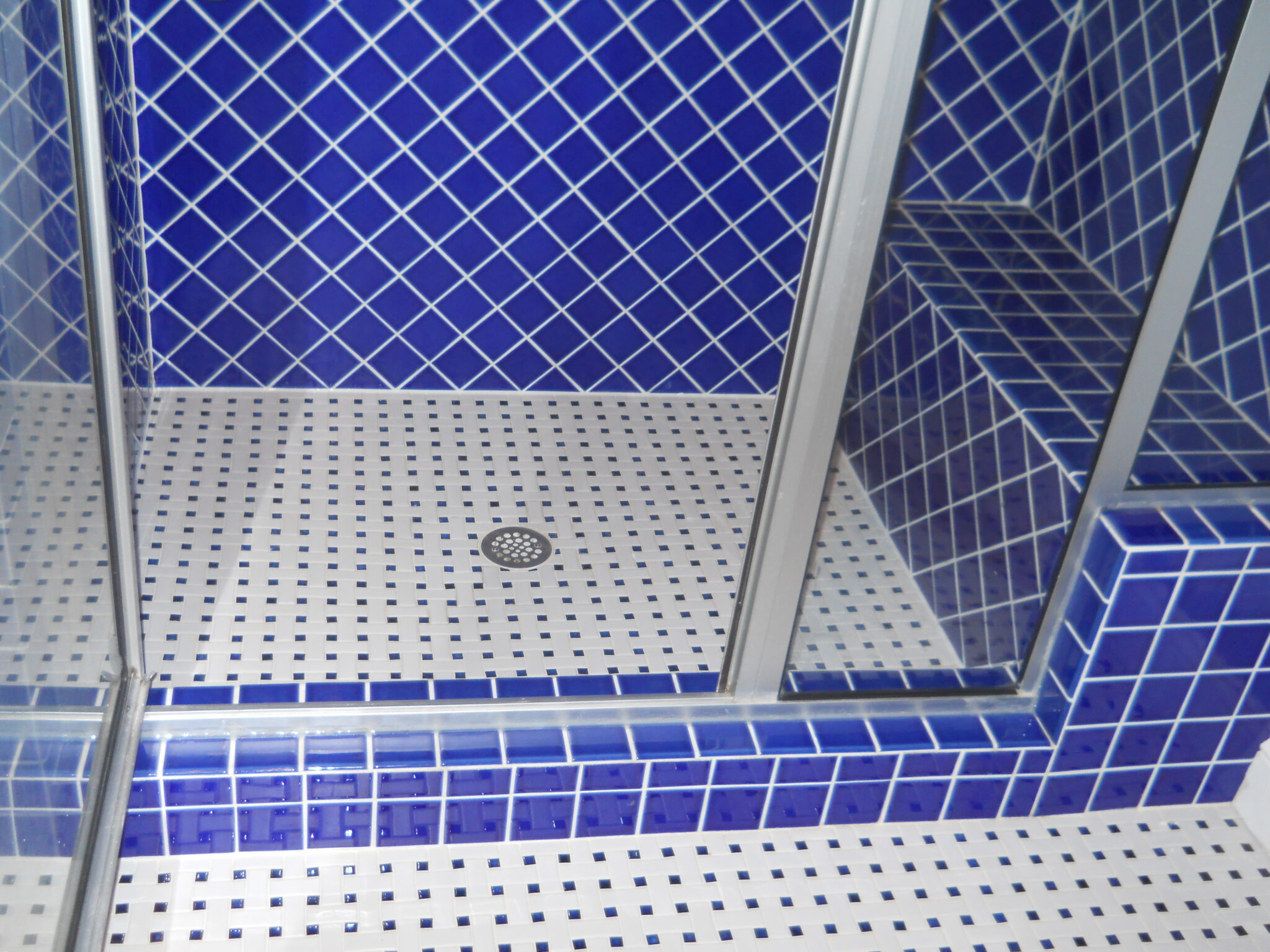 "After" photo of repaired shower tile leak with renewed stepin