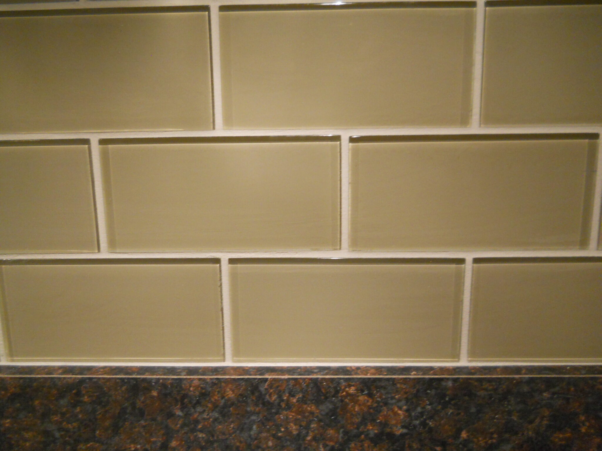 Backsplash grout repair on kitchen tile